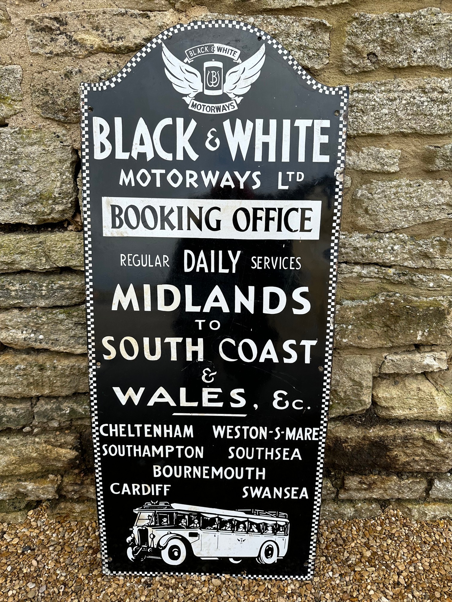 A Black & White Motorways Ltd. Midlands to South Coast & Wales Booking Office enamel advertising