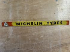 A Michelin Tyres tin shelf strip with image of Mr. Bibendum to left hand side, 18 1/2 x 1 1/4".