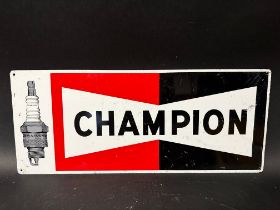 A Champion aluminium advertising sign depicting a Champion Spark Plug, 23 3/4 x 10".