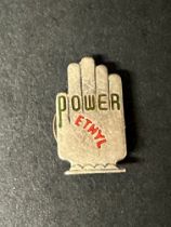 A Power Ethyl 'hand' badge by J.R.Gaunt, London, crescent shaped pin.