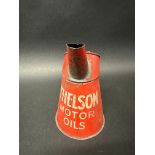 A Thelson Motor Oils quart pourer.