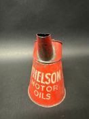 A Thelson Motor Oils quart pourer.