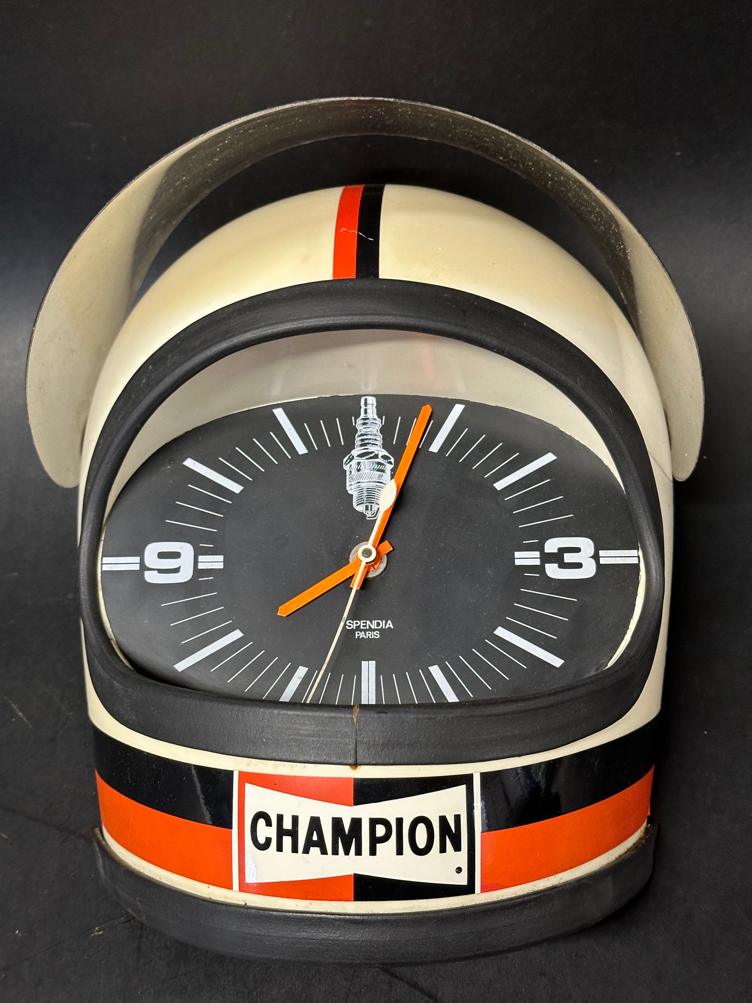 A Champion Spark Plugs advertising wall clock in the form of a racing driver's helmet, battery - Image 2 of 5