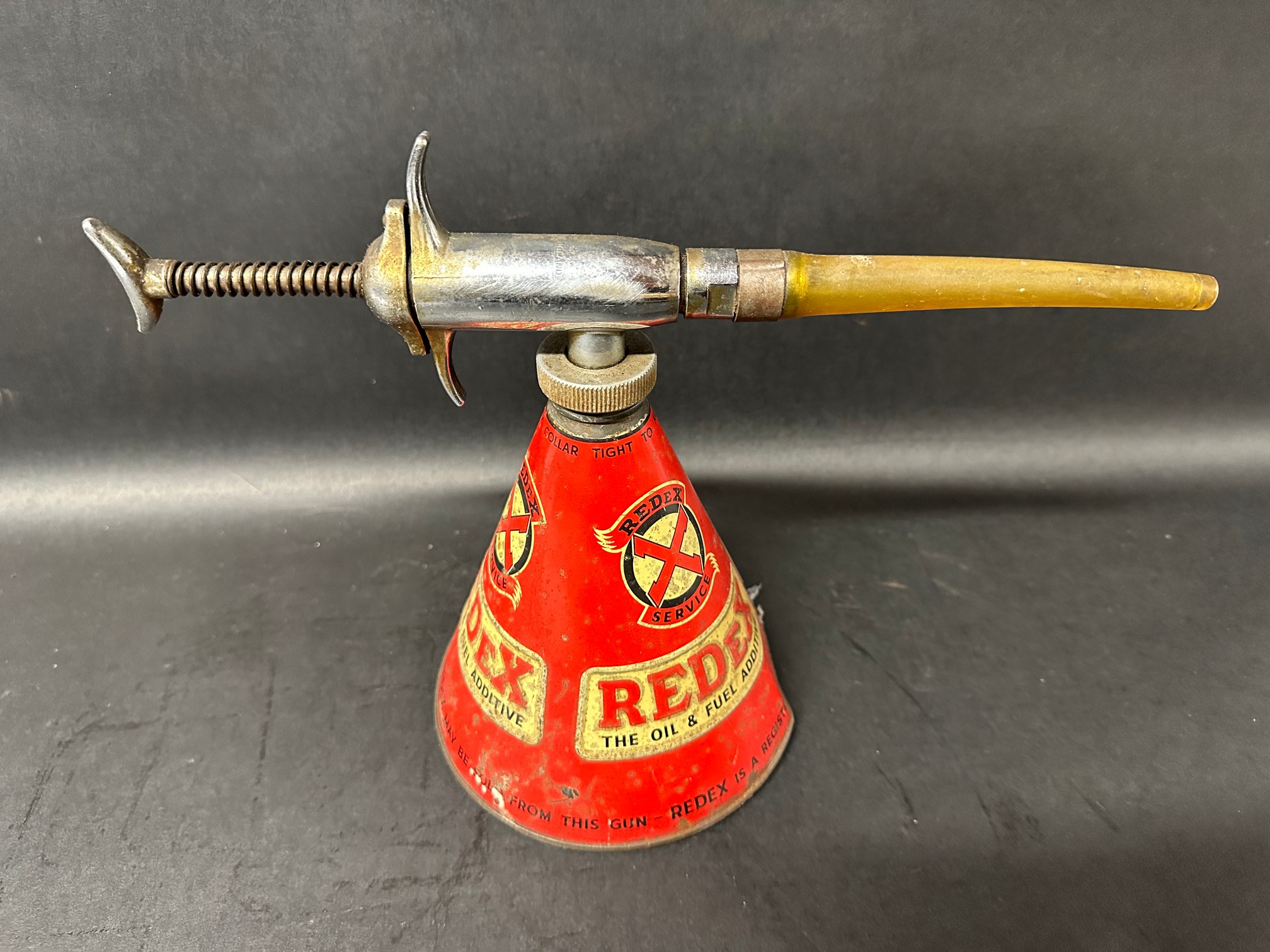 A Redex oil despenser/grease gun.