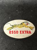 An Esso Extra oval plastic promotional badge depicting the Esso tiger.