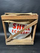 A Shell Economy glass petrol pump globe in original packing crate.