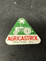 An Agricastrol Tractor Oil triangular plastic badge.