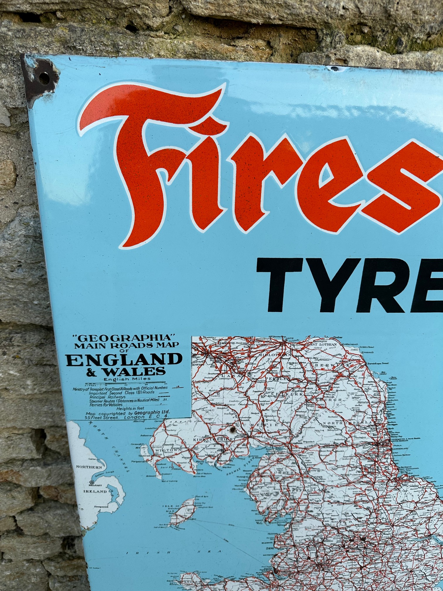 A Firestone Tyres enamel advertising sign depicting a map of England and Wales, 28 1/2 x 48 1/4". - Image 2 of 6