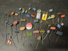 A collection of approximately 42 pins brooches badges all motoring themed including Ferrari,