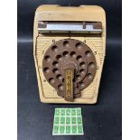 A Green Shield stamp dispenser with 15 stamps.