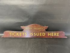 A British Railways 'Tickets Issued Here' hanging wooden ticket headboard, GWR marking on reverse see