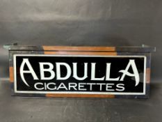 A hanging lightbox with glass panel advertising Abdulla Cigarettes, 35 x 13 x 9".