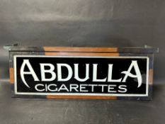 A hanging lightbox with glass panel advertising Abdulla Cigarettes, 35 x 13 x 9