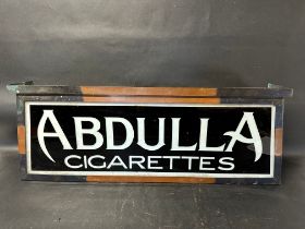 A hanging lightbox with glass panel advertising Abdulla Cigarettes, 35 x 13 x 9".