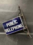 A Public Telephone double sided enamel sign on original bracket, enamel: 18 x 12", with frame 20 1/2