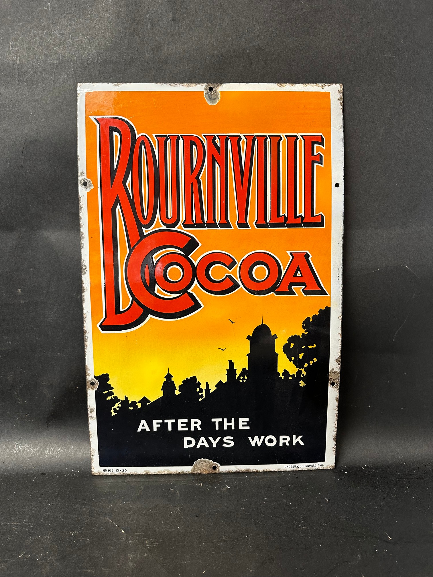 A spectacular advertising sign for Bournville Cocoa 'After the days work', labelled bottom right: