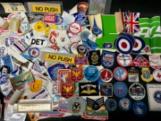 A collection of aviation related sew-on patches and stickers.