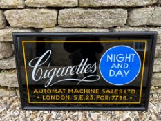 An Automat Machine Ltd. Night and Day glass advertising sign in wooden frame, 29 x 17 1/2