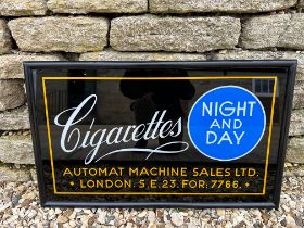 An Automat Machine Ltd. Night and Day glass advertising sign in wooden frame, 29 x 17 1/2".