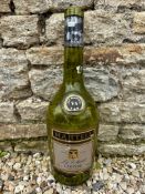 A large Martell Cognac green glass bottle (empty), 19