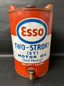 An Esso Two-Stroke (2T) Motor Oil five gallon drum with tap.