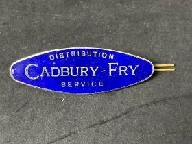 A very rare Cadbury-Fry Distribution Service cap badge, 3 1/4" wide.