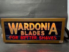 A Wardonia Blades 'For Better Shaves' lightbox, 21 1/2" wide x 9" tall x 10 1/2" deep.