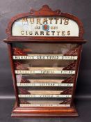 A Muratti's High Class Cigarettes shop counter, glass fronted dispensing cabinet with five side