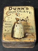 A Dunn's Chocolate of Pentonville tin depicting a housemaid carrying a tea tray, 3 3/4 x 3 x 1 1/