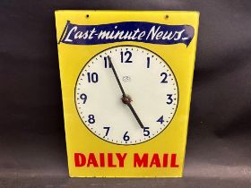 A Sectric Mains glass fronted wall clock bearing advertising for Daily Mail 'Last-minute News', 11 x