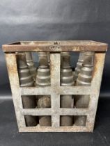 A crate of eight Esso Extra Motor Oil bottles.