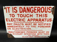 An enamel sign/plaque for Wilson Bros. Bobbin Co. Ltd. 'It is Dangerous to Touch this Electric