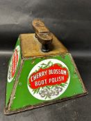 A Cherry Blossom Boot Polish shoe shiner's box with three enamel panels.