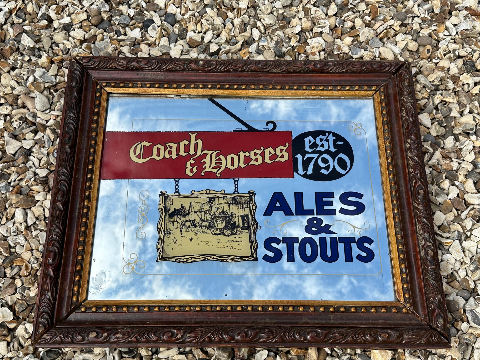 A rectangular advertising mirror for a pub named The Coach and Horses, 24 x 20".