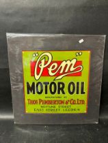 A Pem Motor Oil advertisement, mounted for display, 16 1/4 x 16 1/4".
