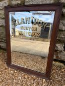 A Clan Ivor Scotch Whisky bevel edged advertising mirror in wooden frame, 15 1/2 x 20 3/4".