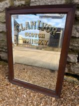 A Clan Ivor Scotch Whisky bevel edged advertising mirror in wooden frame, 15 1/2 x 20 3/4".