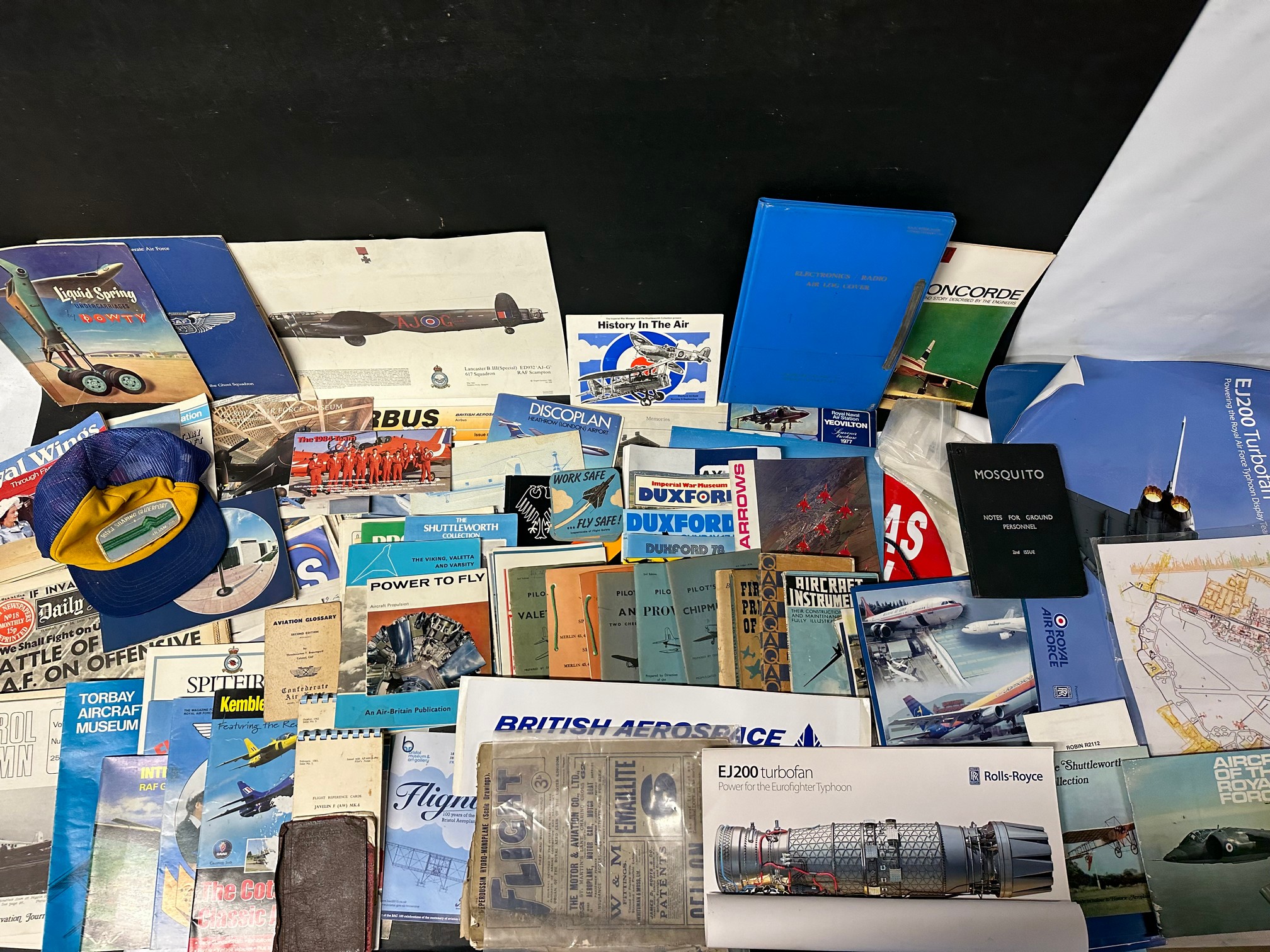 A collection of aviation aeronautical related posters, pilot notes, volumes, log cover, brochures,