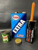 An Esso Extra SAE 20W/50 five litre oil can, a Wakefield Castrolease Grease Graphited 1lb can, a tin