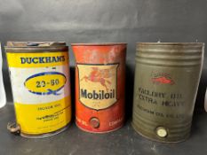Three five gallon drums: Mobiloil ''A'' Vacuum Oil Co. Ltd., Duckham's 20-50 Motor Oil with tap
