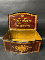 A large counter top dispensing tin for Mackintosh's de Luxe Assortment toffees.