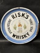 A Risk's Whisky enamel advertising tray by Hancock & Corfield Ltd. 12" diameter.