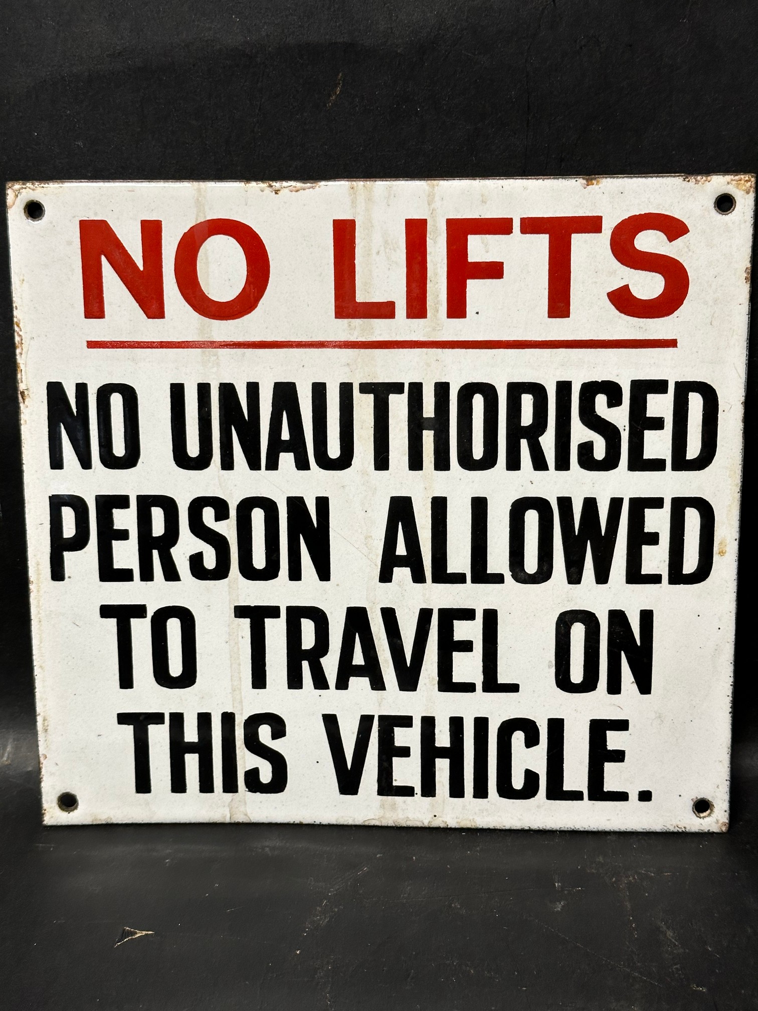 A 'No Lifts' - No Unauthorised Person Allowed To Travel on This Vehicle enamel notice sign, 10 x 9