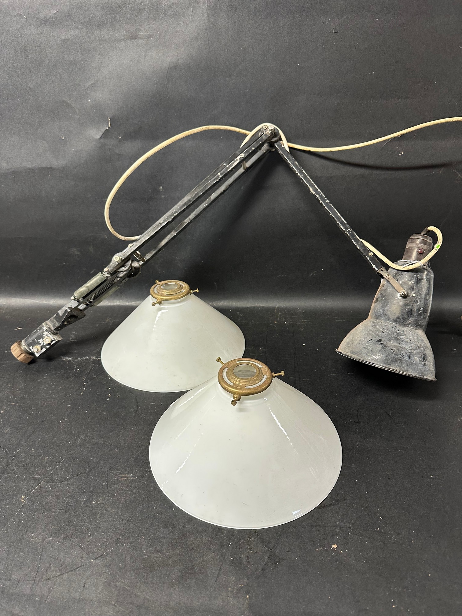 An anglepoise desk lamp marked A M SC/1079 HT&S and two attractive glass lampshades.