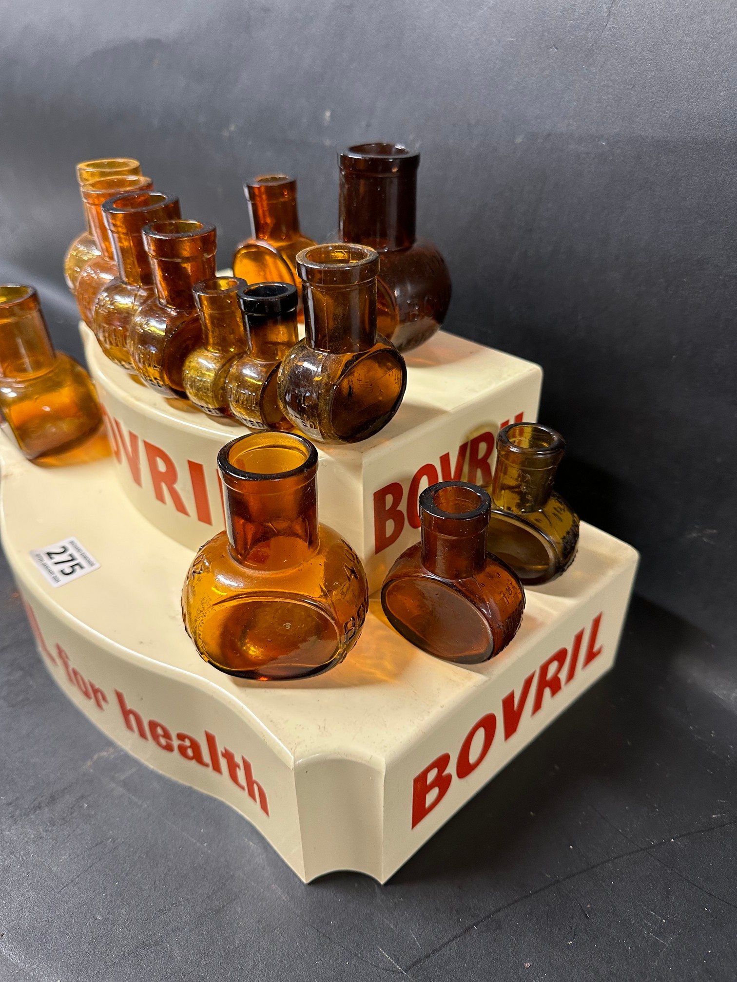 A two tier plastic Bovril shop display stand with associated glass bottles. - Image 3 of 4