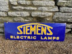A Siemens Electric Lamps enamel advertising sign, carefully trimmed from larger sign, 37 x 11 1/2