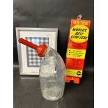 An AlumAseal World's Best Stop Leak wall dispenser, a framed and glazed Fina fabric sample and a