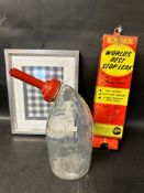 An AlumAseal World's Best Stop Leak wall dispenser, a framed and glazed Fina fabric sample and a