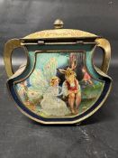 A Huntley & Palmer biscuit tin with Shakespearean scenes from Midsummer Night's Dream and As You