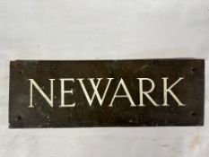 A brass door plaque 'Newark', 10 1/2 x 3 1/2